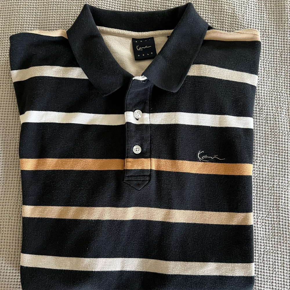 Karl Kani polo shirt.  Take it back to the heights of 90’s style.